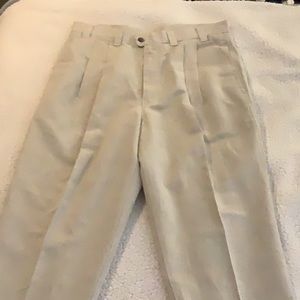 NWOT men’s Dockers 34 x 32 beige pleated pants. See pictures for measurements.